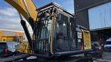 A 2018 Cat 326F Track excavator with a black and yellow exterior and a modern cab design