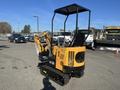 A yellow and black 2024 AGT H12R compact excavator with a cabin and tracks positioned on a construction site