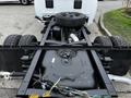 A 2018 RAM 3500 truck chassis viewed from above showing the undercarriage with dual rear wheels and a tire mounted on the frame