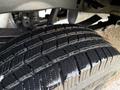 Close-up of a treaded tire from a 2017 Ford F-350 SD showcasing deep grooves and a rugged design for enhanced traction