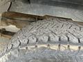 Close-up of a textured tire tread from a 2010 Dodge Ram showing visible wear and dirt on the tread surface