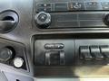 The dashboard controls of a 2016 Ford F-350 SD including air conditioning knobs and various function buttons