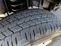 Close-up of a tire from a 2019 Ford Econoline showcasing its tread pattern and rubber texture