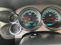 Dashboard of a 2013 Chevrolet Silverado Hybrid showing speedometer odometer and hybrid indicator lights