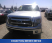 A silver 2013 Ford F-150 with a prominent front grille and headlights visible