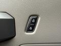 A button panel for locking and unlocking doors in a 2018 Ford F-150 featuring two buttons with lock and unlock symbols