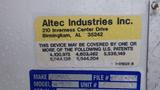 A yellow label on a white surface with text that includes the company name Altec Industries Inc and an address along with patent numbers and a vehicle make information