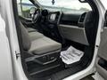 Interior view of a 2017 Ford F-150 showing the front seats dashboard and center console with controls and displays