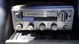 A vintage Pioneer cassette deck with dials for bass treble balance volume and loudness in a Chevrolet Corvette Stingray 1971 interior