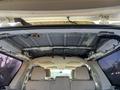 Interior view of a 2013 Ford Expedition showing the roof structure and wiring with visible roof lining and seating area