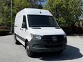 A 2022 Mercedes-Benz Sprinter van in white with a black front grille and no visible license plate