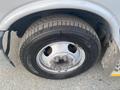 Close-up of a tire and wheel of a 2017 Chevrolet Express showing the tread pattern and wheel design