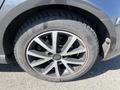 Close-up of a 2016 Audi A3 wheel with a stylish alloy rim and a black tire featuring visible tread and specifications marked on the sidewall