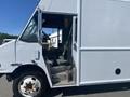 A white 2007 Freightliner MT55 step van with an open door revealing the driver's seat and interior space