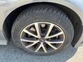 Close-up of a gray 2016 Audi A3 wheel featuring a multi-spoke alloy rim and tire with visible tread pattern