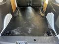 The interior cargo area of a 2022 Ford Transit Connect featuring a flat rubberized floor with mounting points for securing cargo