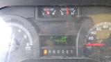 Dashboard of a 2011 Ford Econoline displaying gauges for fuel level and engine temperature along with a trip meter showing 0.0 and an odometer reading of 148754 km/h