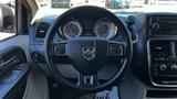 Interior view of a 2016 Dodge Grand Caravan showing the steering wheel dashboard controls and instrument cluster