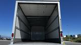 A 2019 International 4300 truck with an empty cargo area visible from the rear doors