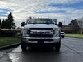 A 2017 Ford F-550 truck facing forward with a shiny chrome grille and prominent headlights