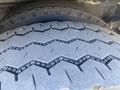 Close-up of a tire on a 2007 Freightliner MT55 showing a rugged tread pattern designed for traction and stability on various surfaces