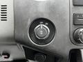 Control knob in the dashboard of a 2011 Ford F-250 SD with markings for ON and OFF positions