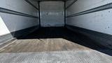 Empty interior of a 2019 International 4300 truck showing wooden flooring and metal walls with no cargo inside