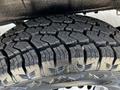 Close-up of a rugged tire tread designed for a 2022 Mercedes-Benz Sprinter showcasing deep grooves and a durable pattern for enhanced traction
