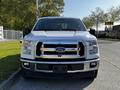 A 2017 Ford F-150 in white color facing forward with a chrome grille and visible headlights
