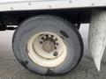 Close-up of a tire on a 2008 Hino 268 showing tread patterns and rust on the wheel rim