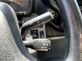 Close-up of the steering wheel controls of a 2020 Hino 195 showing buttons for cruise control and additional vehicle settings