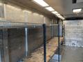 2005 Freightliner MT45 Chassis with metal shelving units installed inside the cargo area