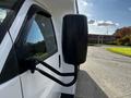 2015 Chevrolet Express side mirror with a black housing and arm extending from the vehicle