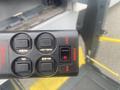 A black control panel with buttons labeled for operation on a 2017 Chevrolet Express van