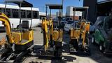 Three yellow 2021 Cael-1T Mini excavators parked in a row with tracks and a compact design