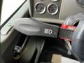 Close-up of the turn signal lever in a 2014 Kenworth T370 with a textured grip and indicator symbols for lights and hazards