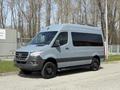 2019 Mercedes-Benz Sprinter van in gray with a sleek design and tinted windows parked on a concrete surface