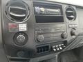 Dashboard of a 2011 Ford F-250 SD featuring audio controls knobs and buttons including a radio and climate control settings