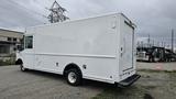 A white 2006 Ford Econoline box truck with a plain exterior and no visible markings parked in an outdoor area