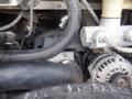 Close-up of the engine compartment of a 2007 Morgan Olson Workhorse W42 showing various components including hoses and an alternator