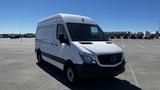 2016 Mercedes-Benz Sprinter van in white with a tall cargo area and front grille featuring the Mercedes-Benz logo