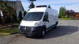 White 2017 RAM Promaster van parked with a roof-mounted air conditioning unit and a black front grille