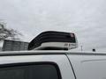 A rooftop air conditioning unit mounted on a 2009 Chevrolet Express van