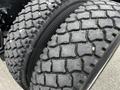 Close-up of a rugged tire on a 2014 Kenworth T370 with deep treads designed for traction and stability
