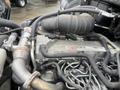 Close-up of a Hino 268 engine showing various components including the turbocharger air intake, engine block, and multiple connected hoses and wiring