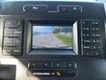 Dashboard display of a 2017 Ford F-150 showing a rearview camera view with guiding lines for parking assistance