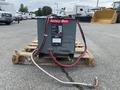 A 2004 Crown RR5210-35 battery charger featuring multiple cables and a gauge attached to a wooden pallet