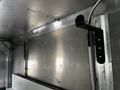 Interior of a 2006 Morgan Olson Workhorse W42 Step Van showing metal walls and a mounted pole for storage or support