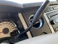 Close-up of a 2013 Ford Expedition interior showcasing the steering wheel, dashboard gauges, and control knobs