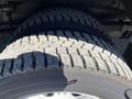 Close-up of a tire from a 2011 Ford Econoline showing tread pattern and sidewall details